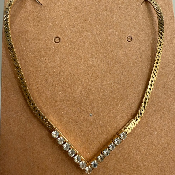 Avon Jewelry - Vintage Avon gold-tone V-shaped pendant accented with clear crystal rhinestones